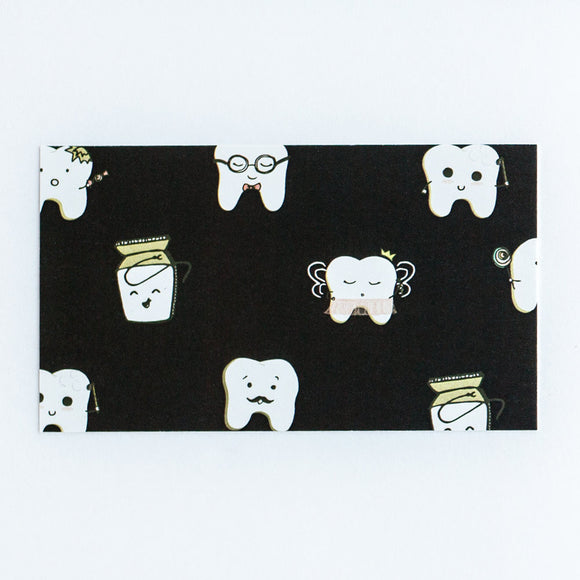 Black front side of appointment card with cute teeth characters all over the front.